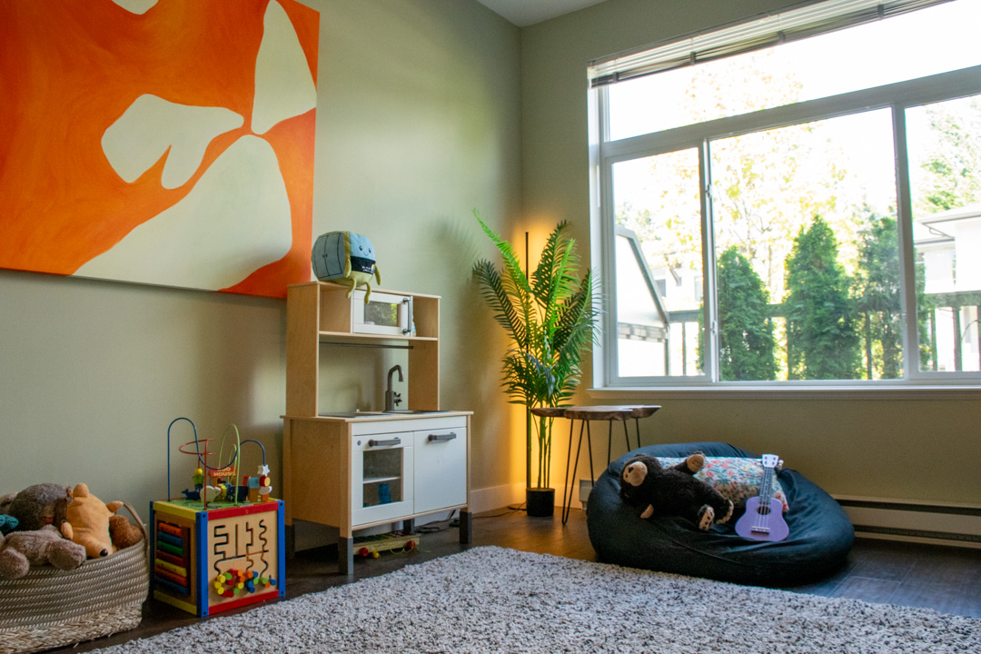 Spacious living room with large windows and natural light
